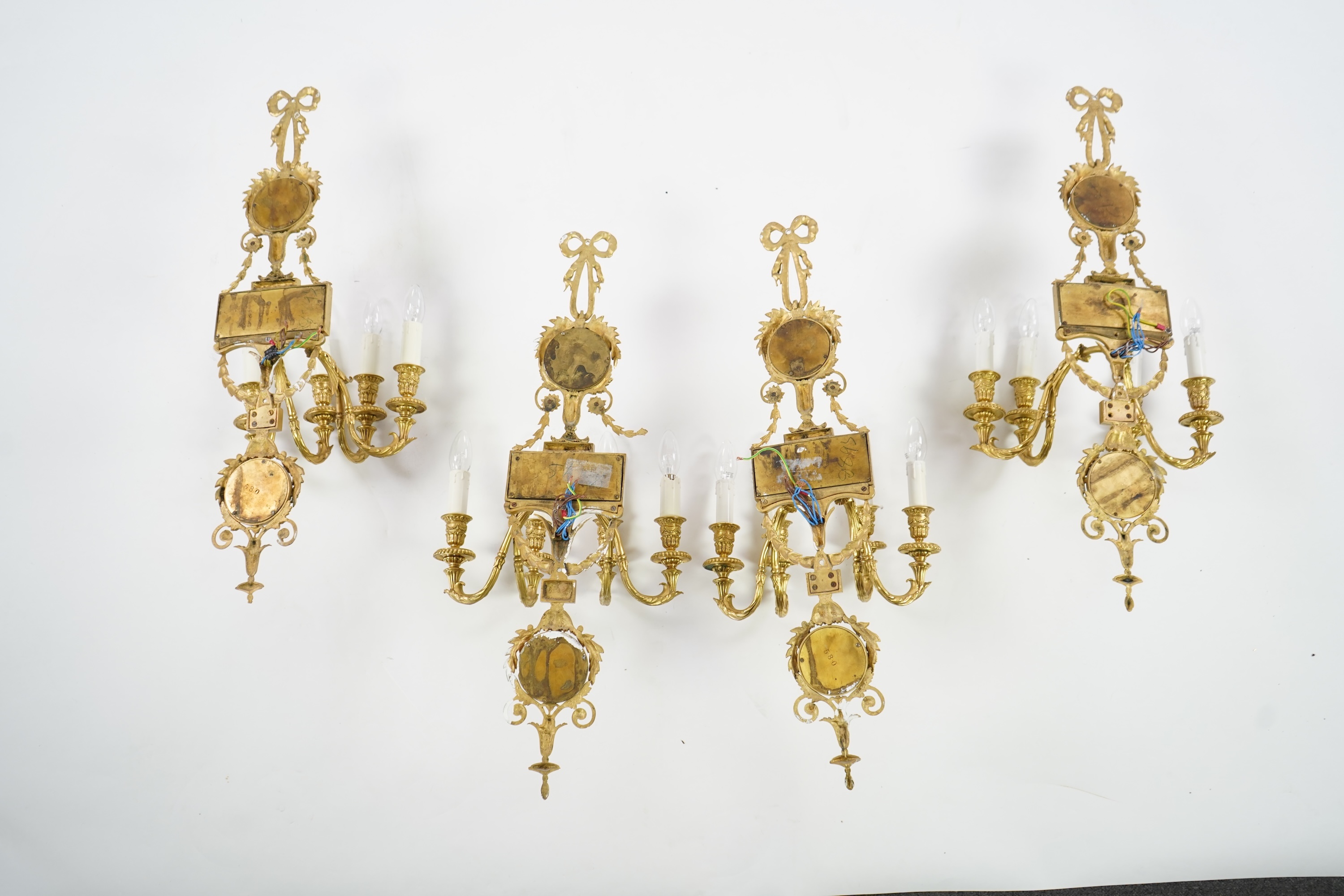 A set of four Adam style ormolu and jasper ware mounted wall appliques, early 20th century